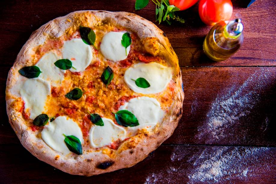 Diferente da tradição, a margherita especial tem pequenos pedaços de tomate Diferente da tradição, a margherita especial tem pequenos pedaços de tomate