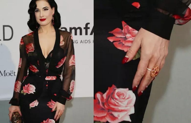 A atriz burlesca Dita Von Teese é adepta da unha decorada com a meia lua invertida