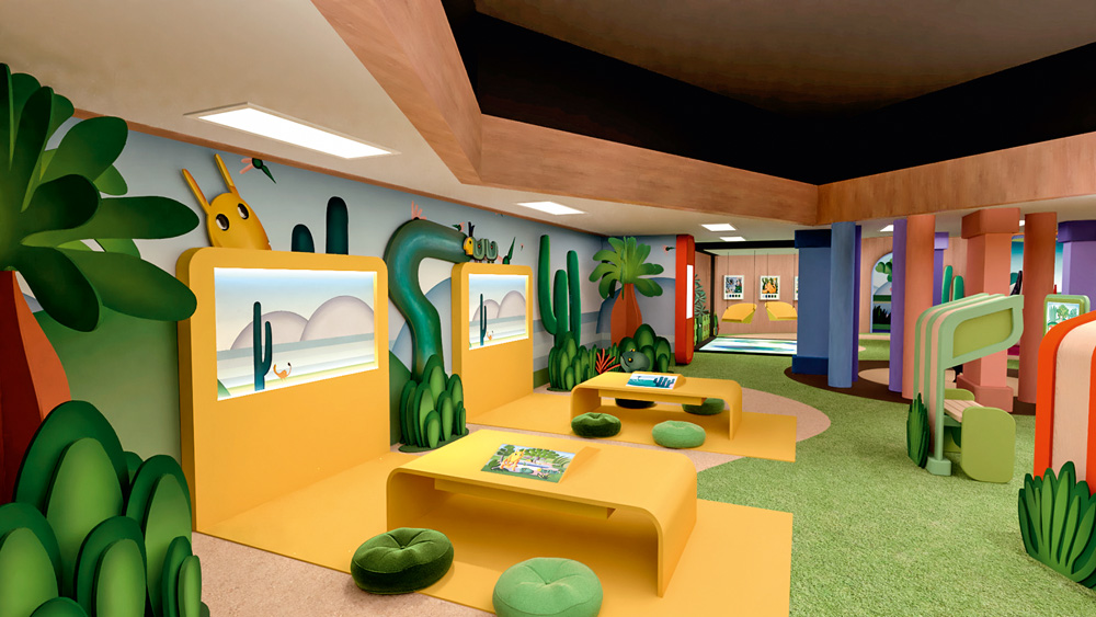 Uma sala interativa pintada com base em obras da Tarsila do Amaral tem duas telas e duas mesas com desenhos da pintora, com lugares para sentar e interagir