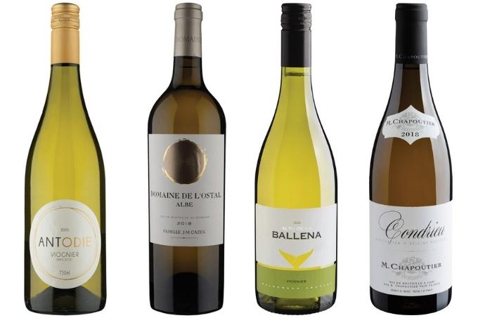 Montagem em fundo branco de quatro garrafas diferentes de vinho