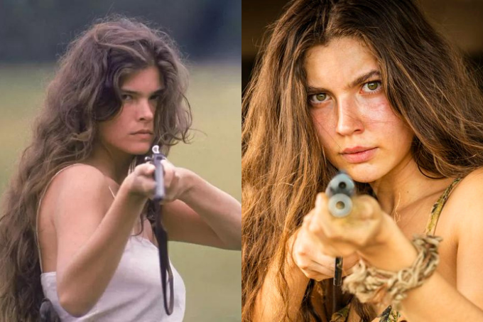 Imagem mostra duas mulheres segurando armas e apontado para a câmera.