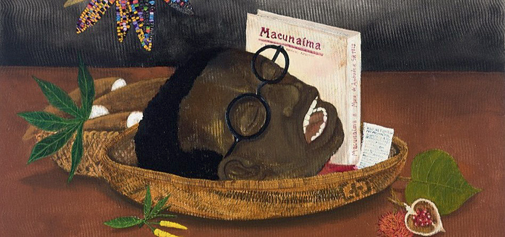 macunaíma crédito MIS.jpeg (1) Imagem mostra desenho de cabeça de homem negro em bacia, ao lado de livro com o título