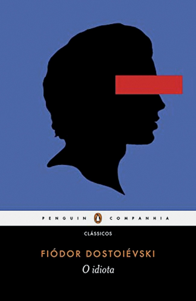 Livro O Idiota.jpg Livro O Idiota, de Fiódor Dostoiévski. Capa azul tem silhueta de homem preta, com faixa vermelha nos olhos
