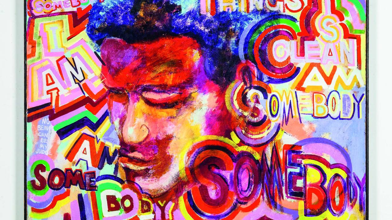 Imagem exibe quadro colorido nas cores vermelho, azul, rosa e amarelo com traços de um rosto no centro.