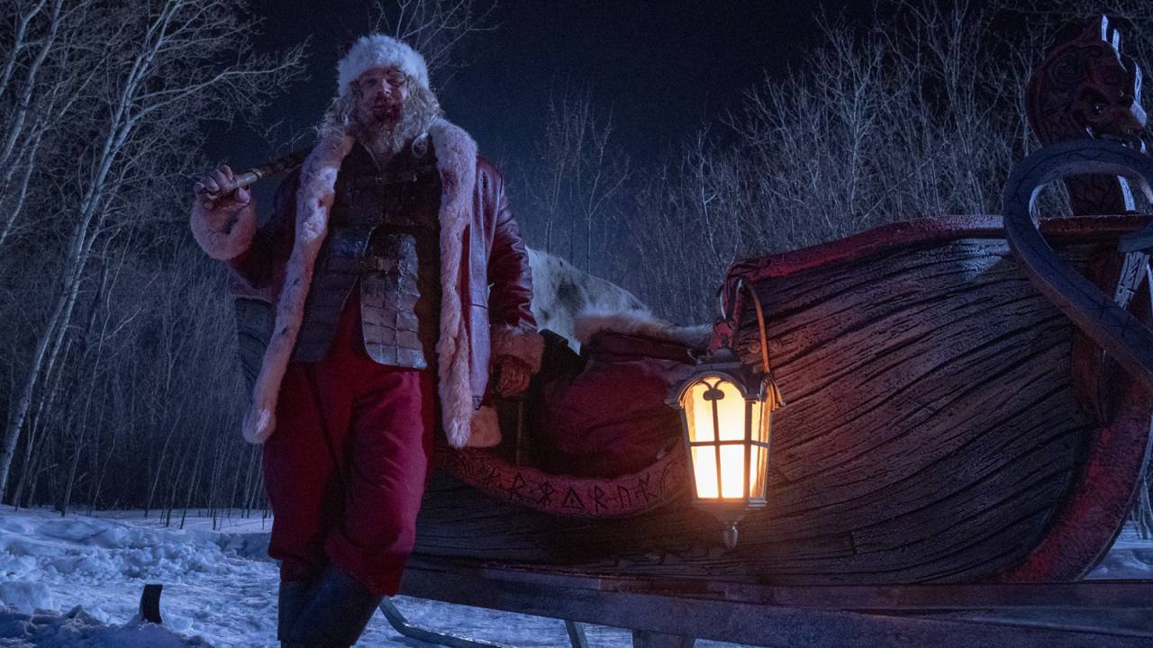 Papai Noel na neve em seu trenó